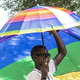 A man identifying himself as a member of the lesbian, gay, bisexual and transgender (LGBT) community participates in a parade in Entebbe, southwest of Uganda’s capital Kampala, August 8, 2015